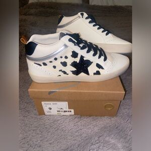 Daisy cow print tennis shoes